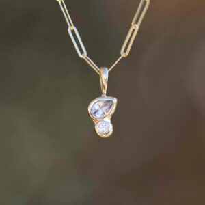 Diamond and White Sapphire Pendant in 14k Gold